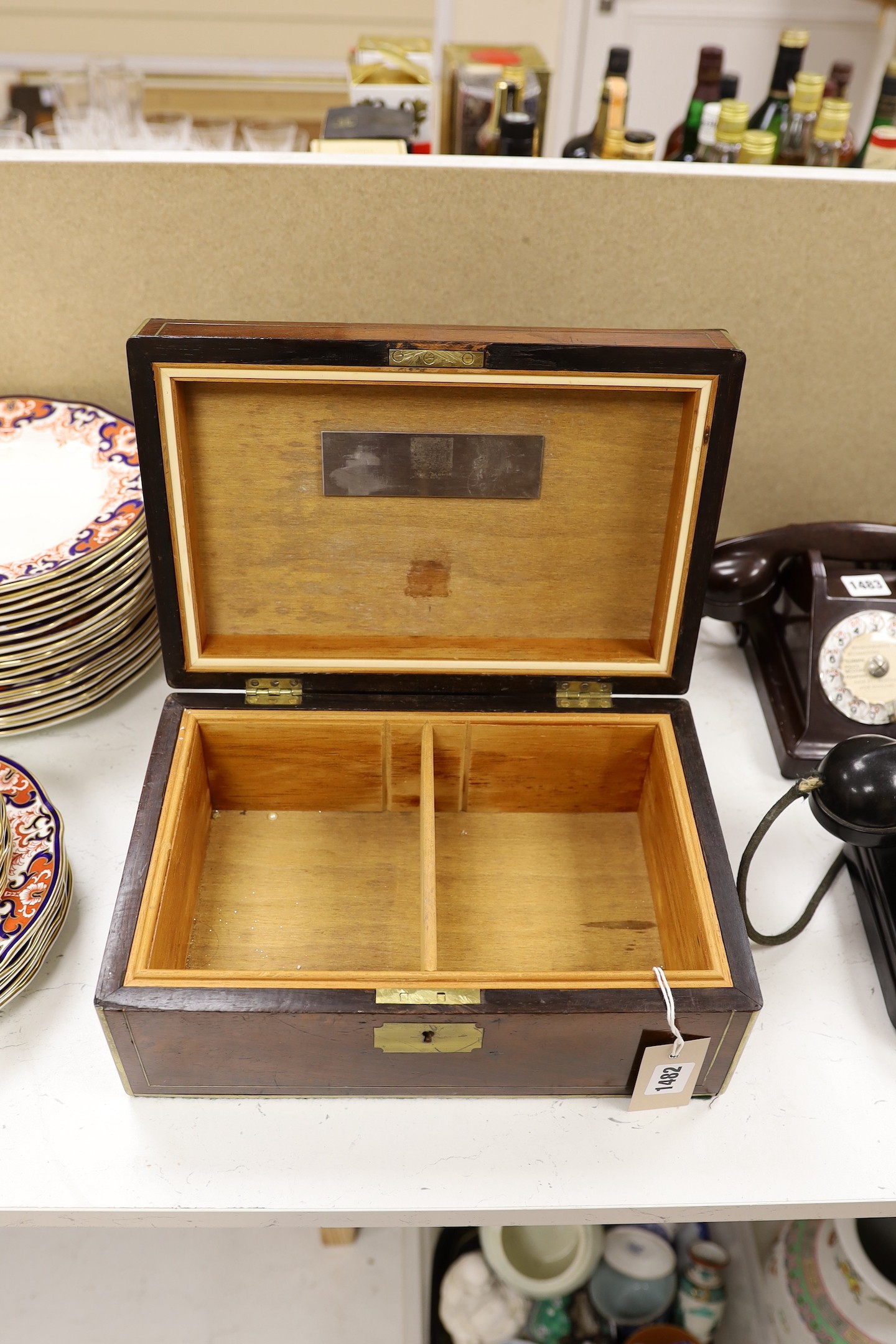 A brass bound rosewood humidor together with a walnut sewing box